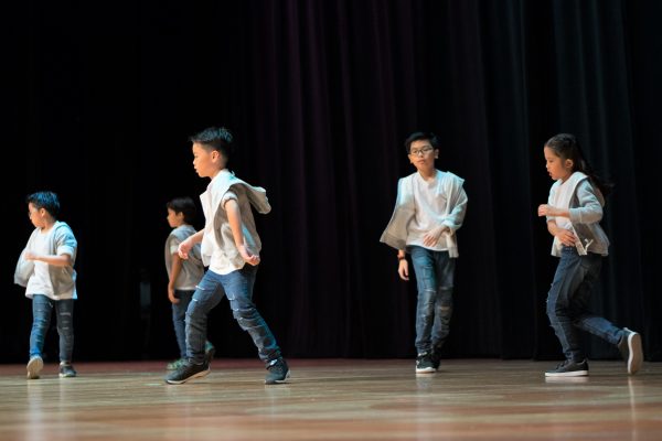 Fine momentum dance class students performing on stage
