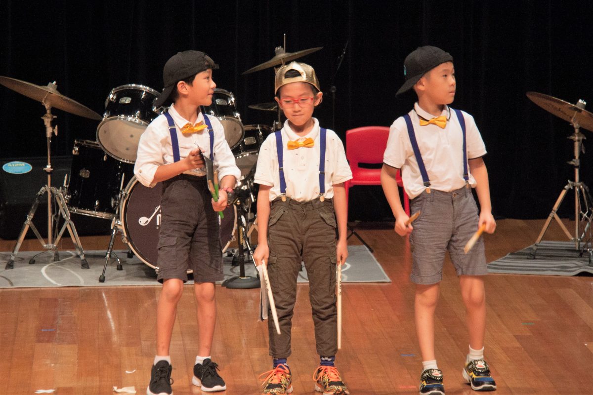 Fine momentum music class students performing on stage