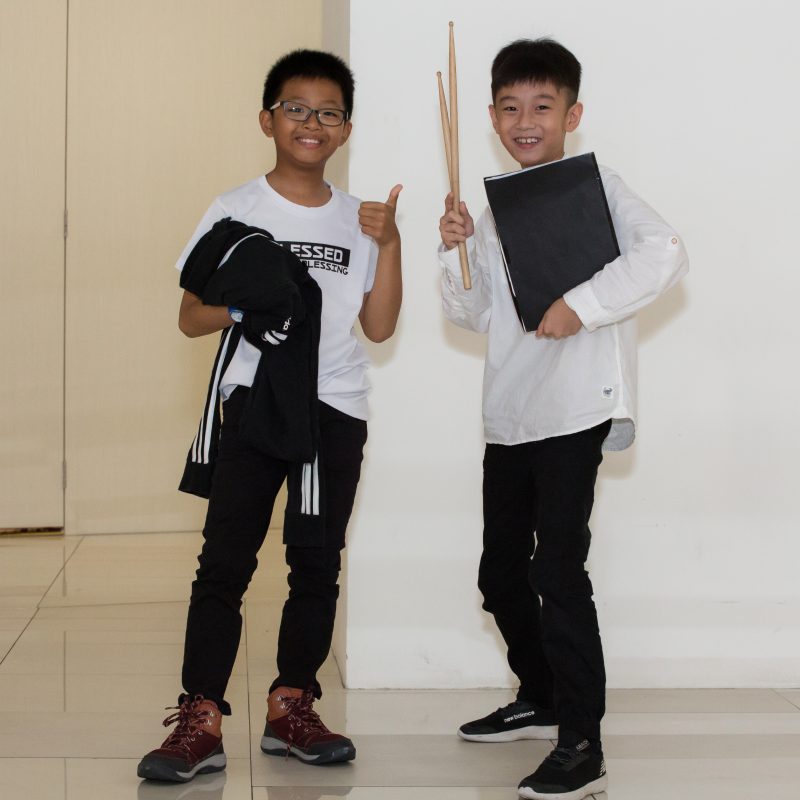 Fine momentum music class student posing