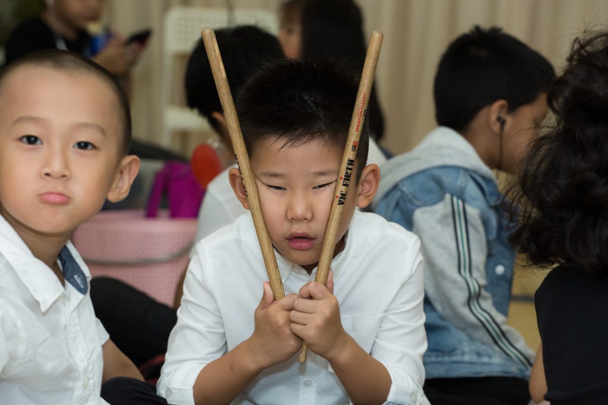 Fine momentum music class student posing