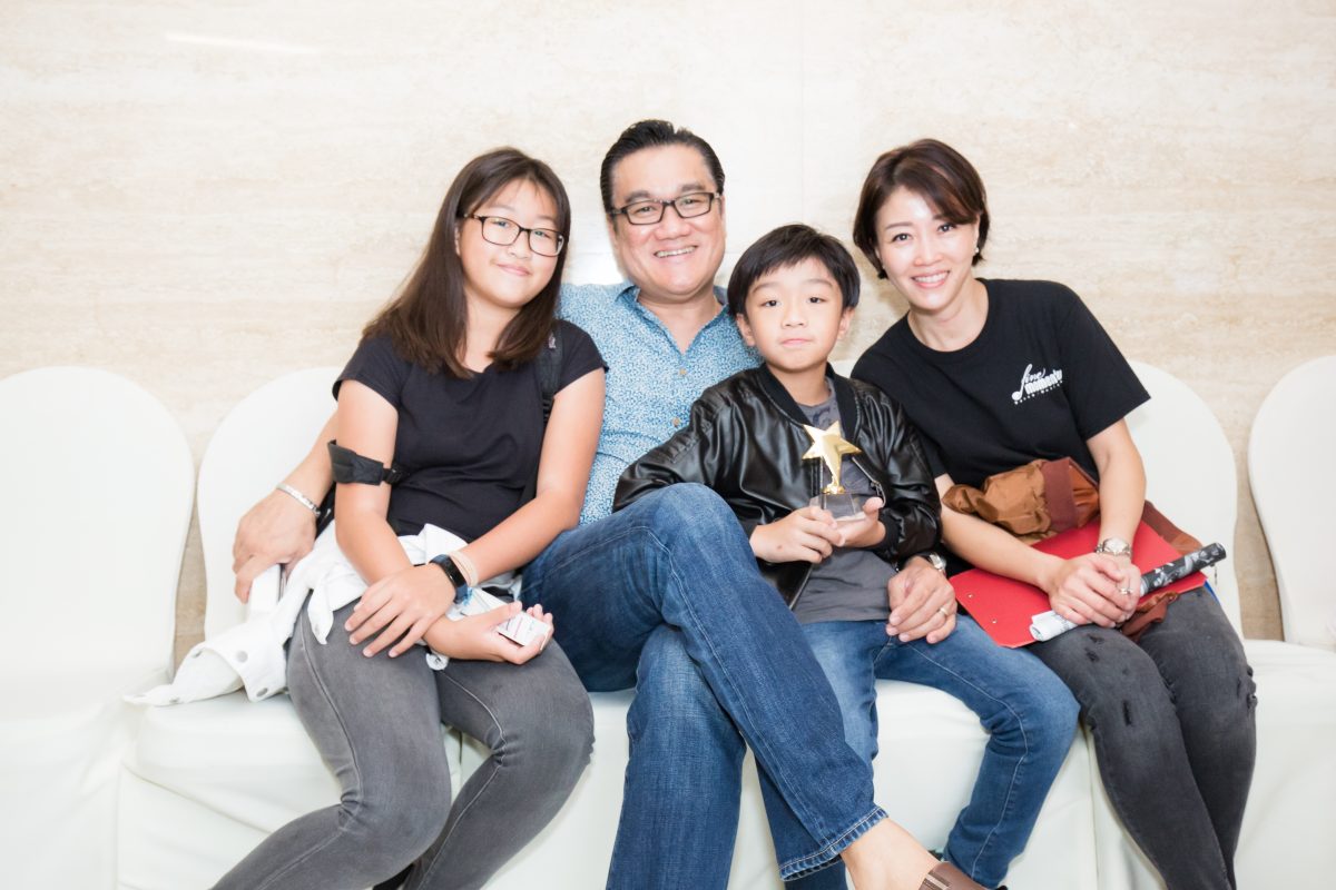 Fine momentum music class students with parents at concert