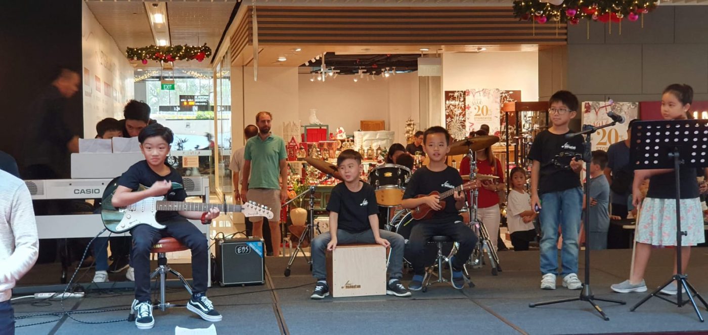 Fine momentum music class students performing on stage