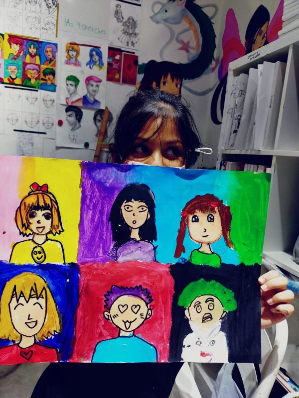 Fine momentum art class student showcasing her artwork