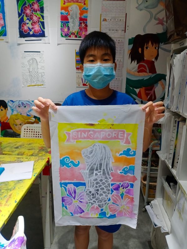 Fine momentum art class student showcasing his artwork