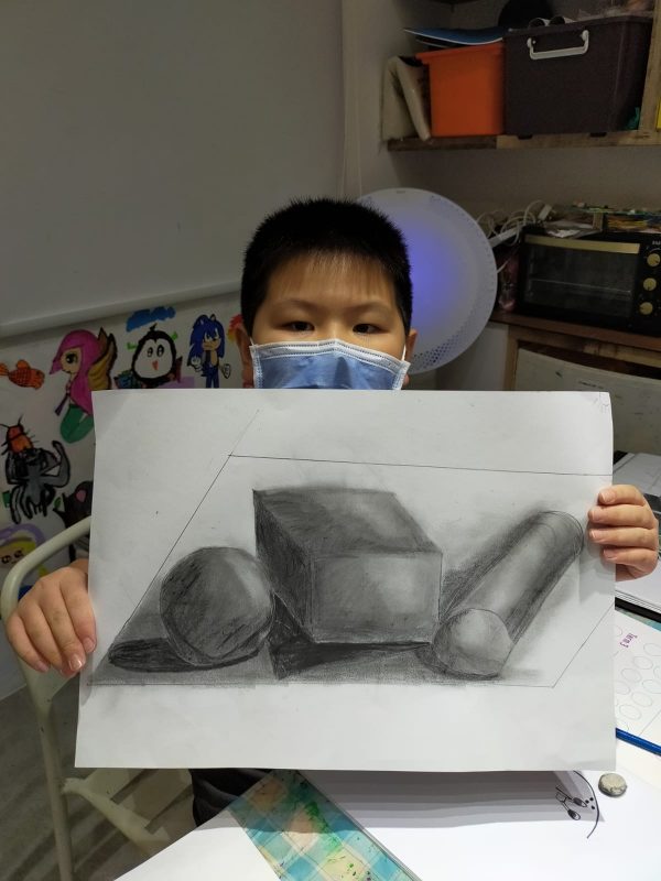 Fine momentum art class student showcasing his artwork