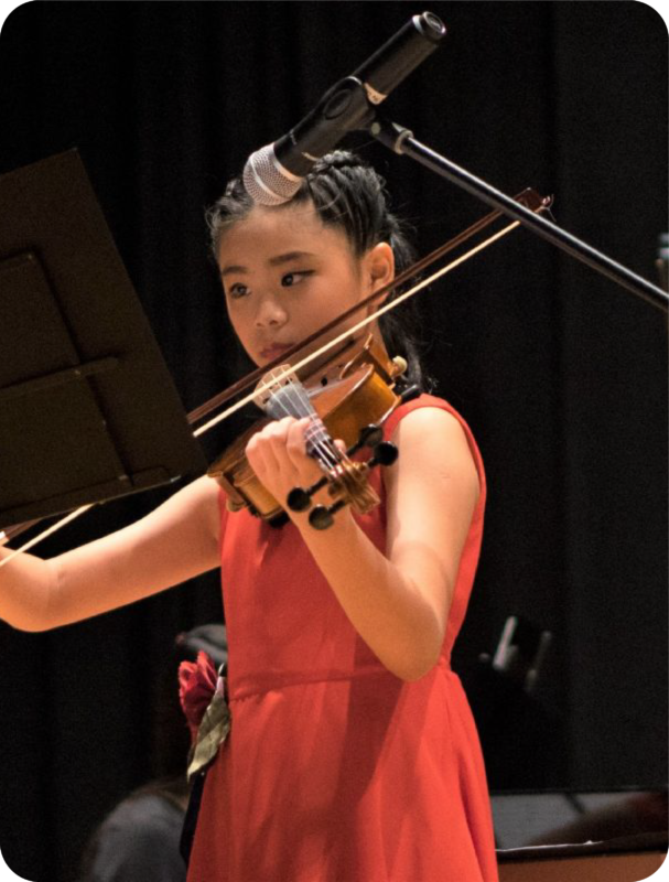 Fine momentum music class student performing the violin