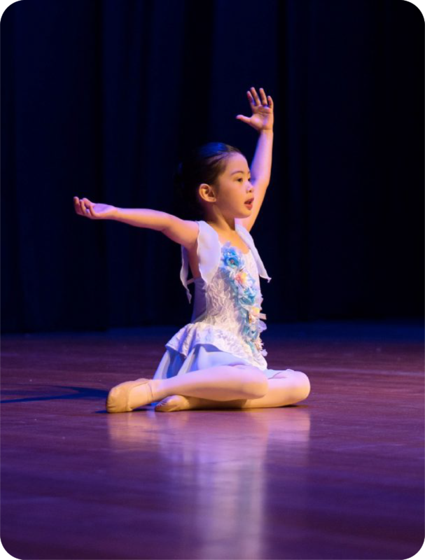 Fine momentum ballet classes student performing ballet on stage
