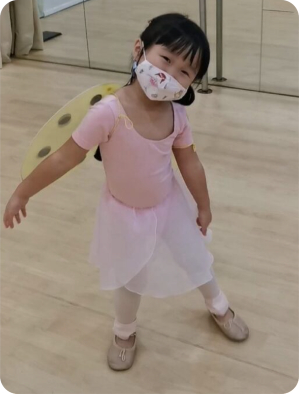 Fine momentum ballet classes for kids student doing ballet poses