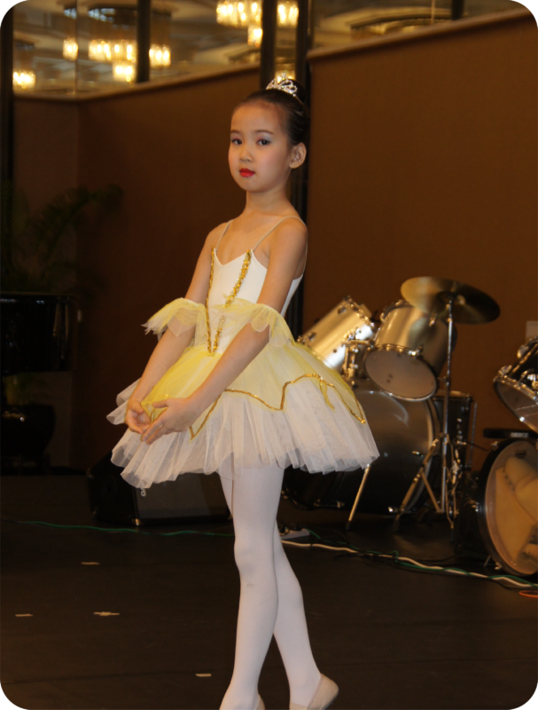 Fine momentum ballet classes student performing ballet on stage