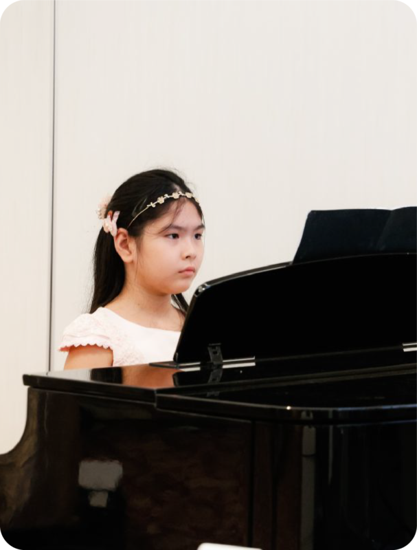 Fine momentum music course piano lessons student performing
