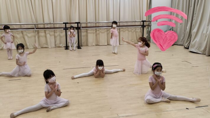 Fine momentum ballet classes for kids students doing ballet poses