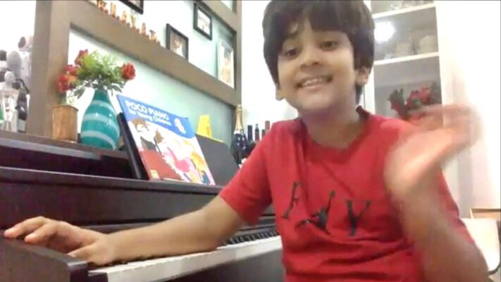 Fine momentum online music piano lesson student enjoying