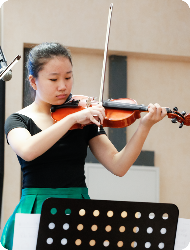 Fine momentum music lesson student playing the violin