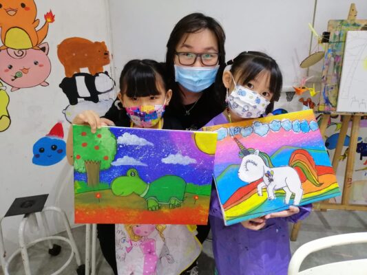 Our art students at Fine momentum showcasing their artwork with instructor after art lessons