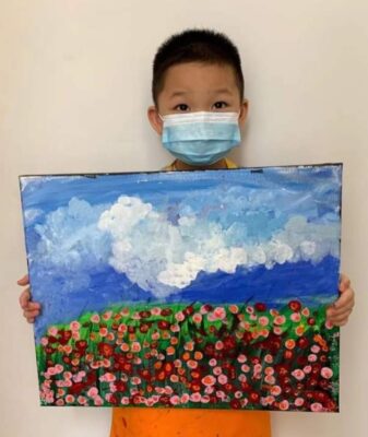 Our art student at Fine momentum showcasing his artwork after art lessons
