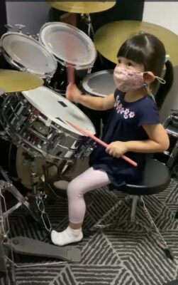 Fine momentum drum classes for kids student playing the drums