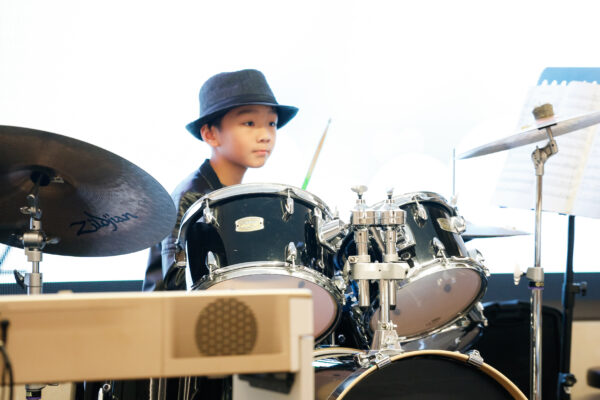 Fine momentum drum classes student playing the drums