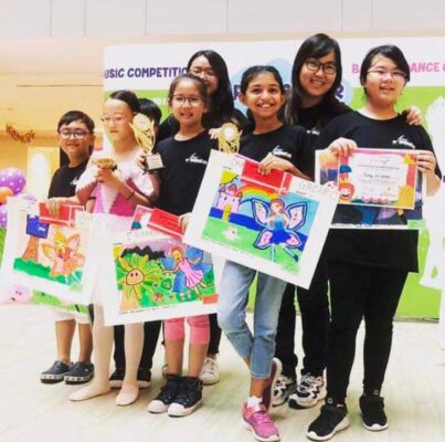 Fine Momentum art students showcasing their works at an art competition