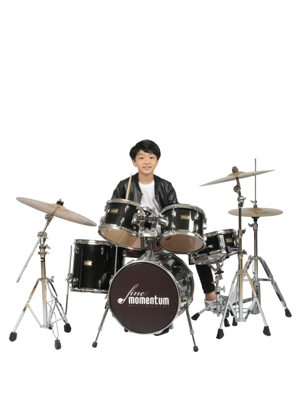 Fine momentum drum classes student playing the drums