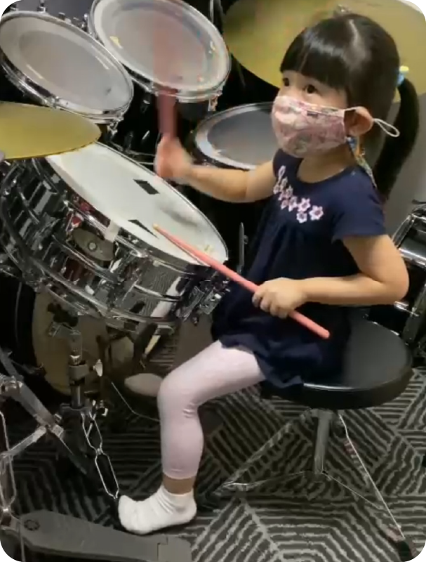 Fine momentum drum classes for kids student playing the drums
